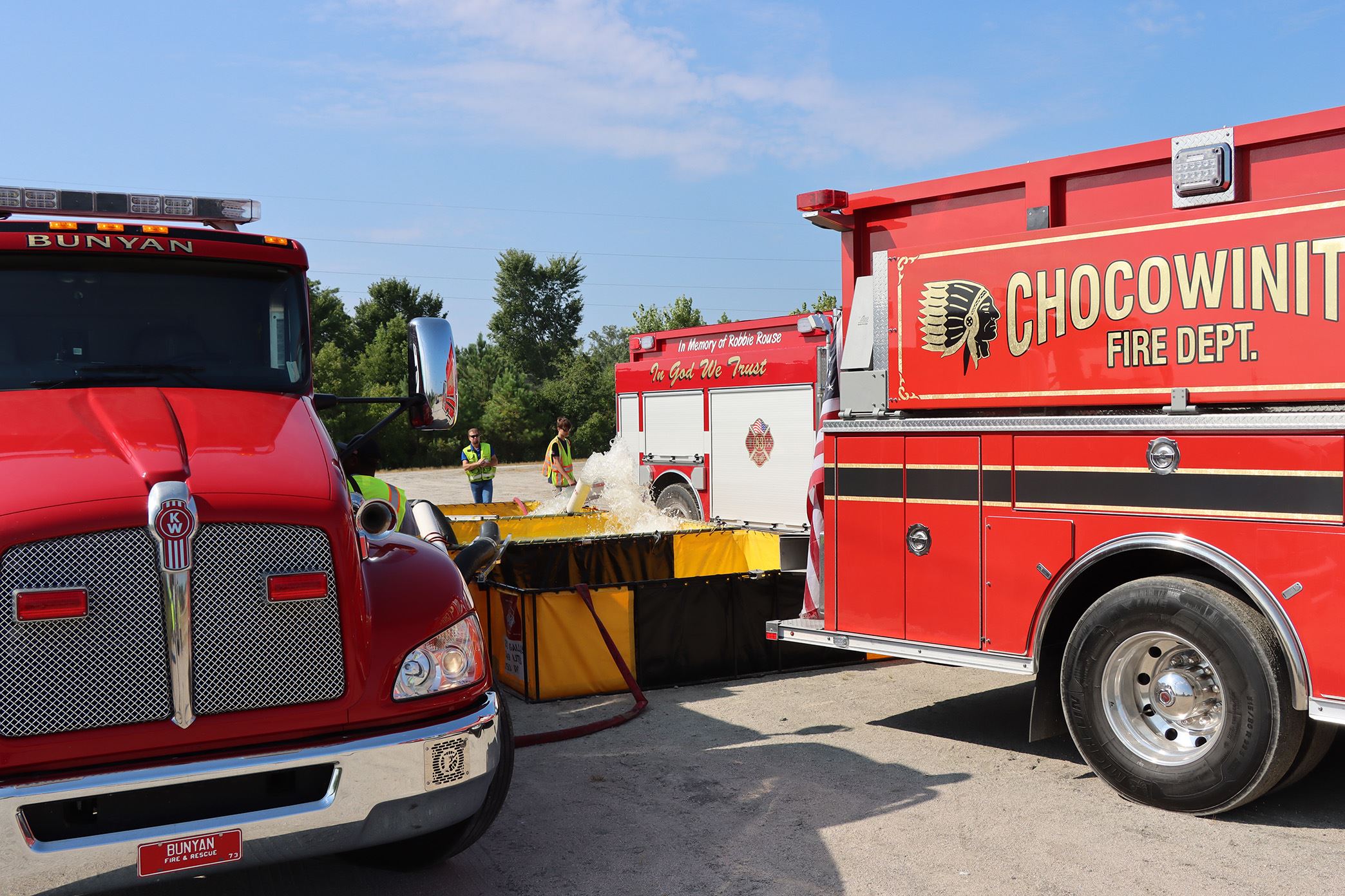 Tankers in position at a fill site during the water shuttle operation